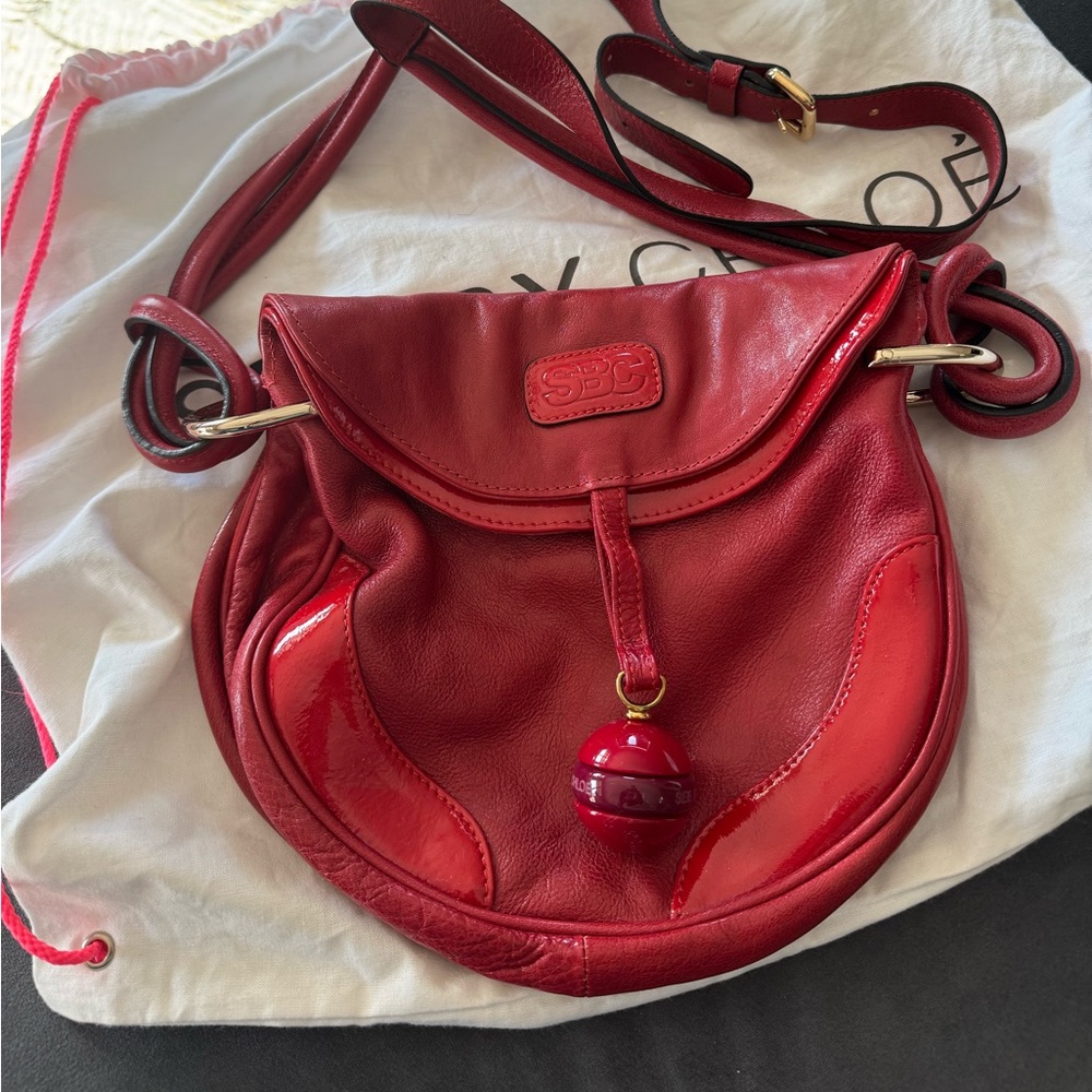 Red crossbody SEE by Chloe bag.